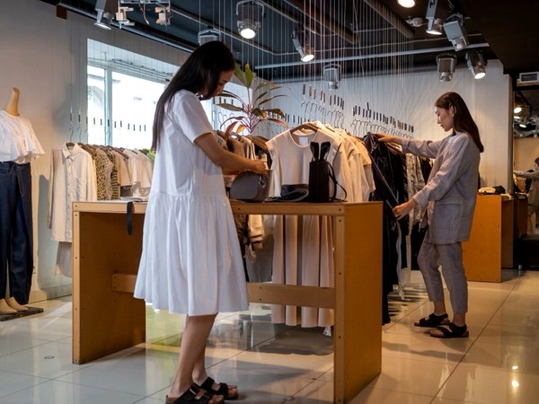 Finished apparel merchandised on rails in a retail store